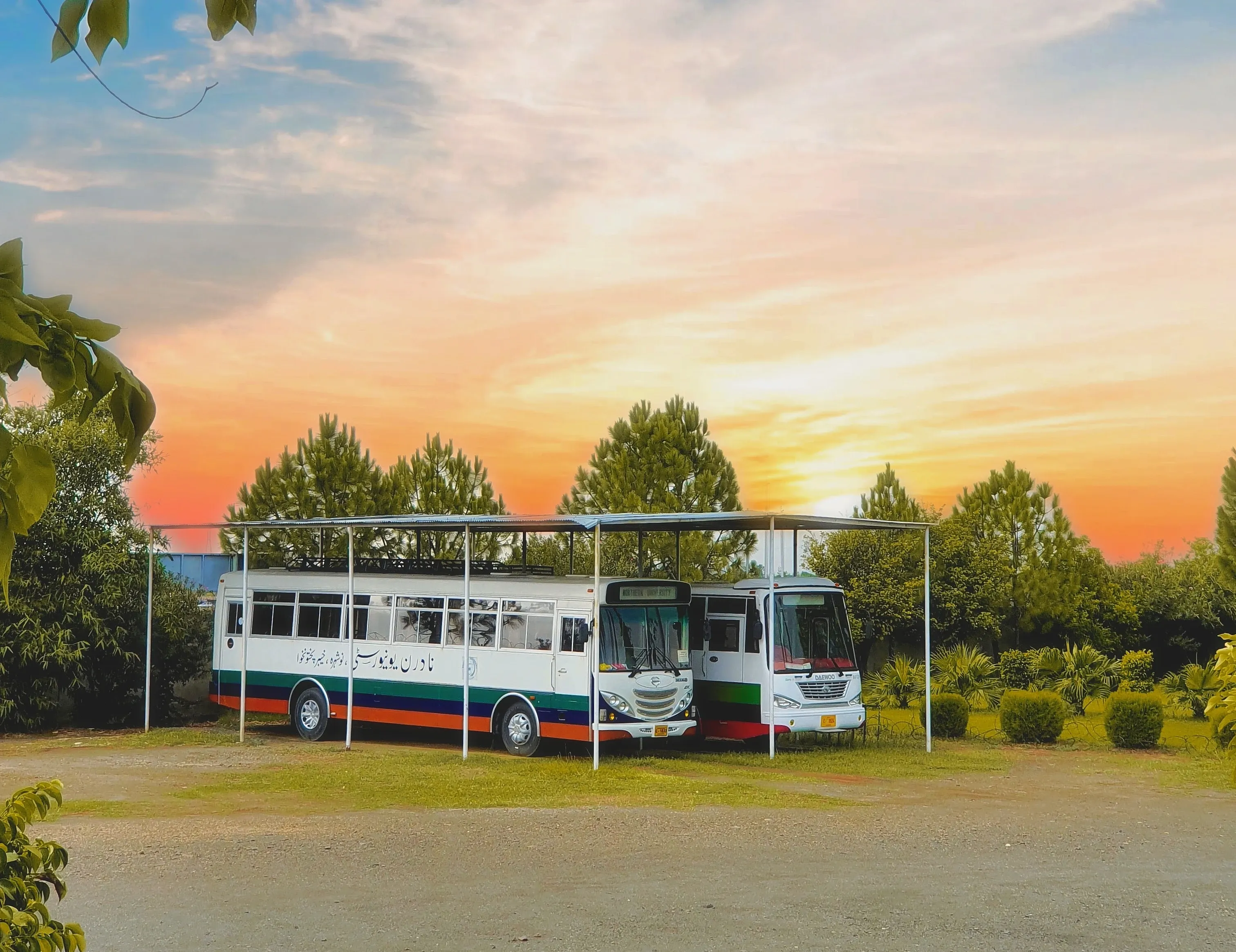 Northern University bus parked on campus, ready for student and faculty transport service